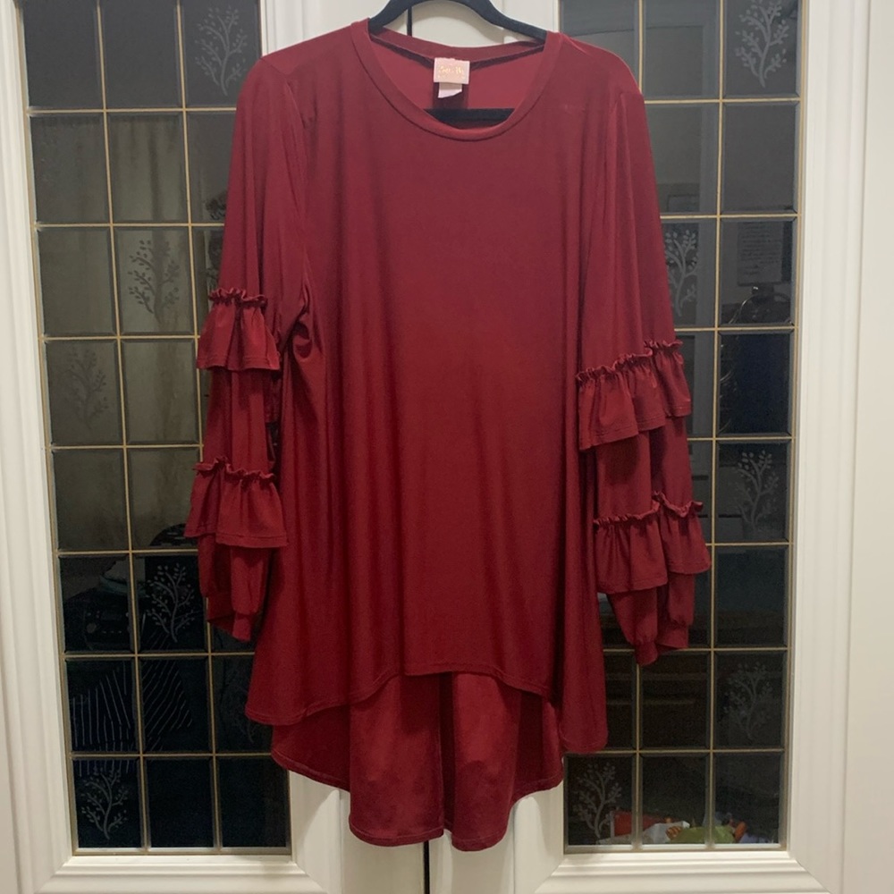 Zadie B’s burgundy Amelia high low blouse.